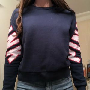 navy blue crew neck with red and white letters